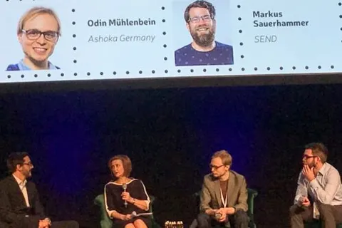 Odin speaking on a panel